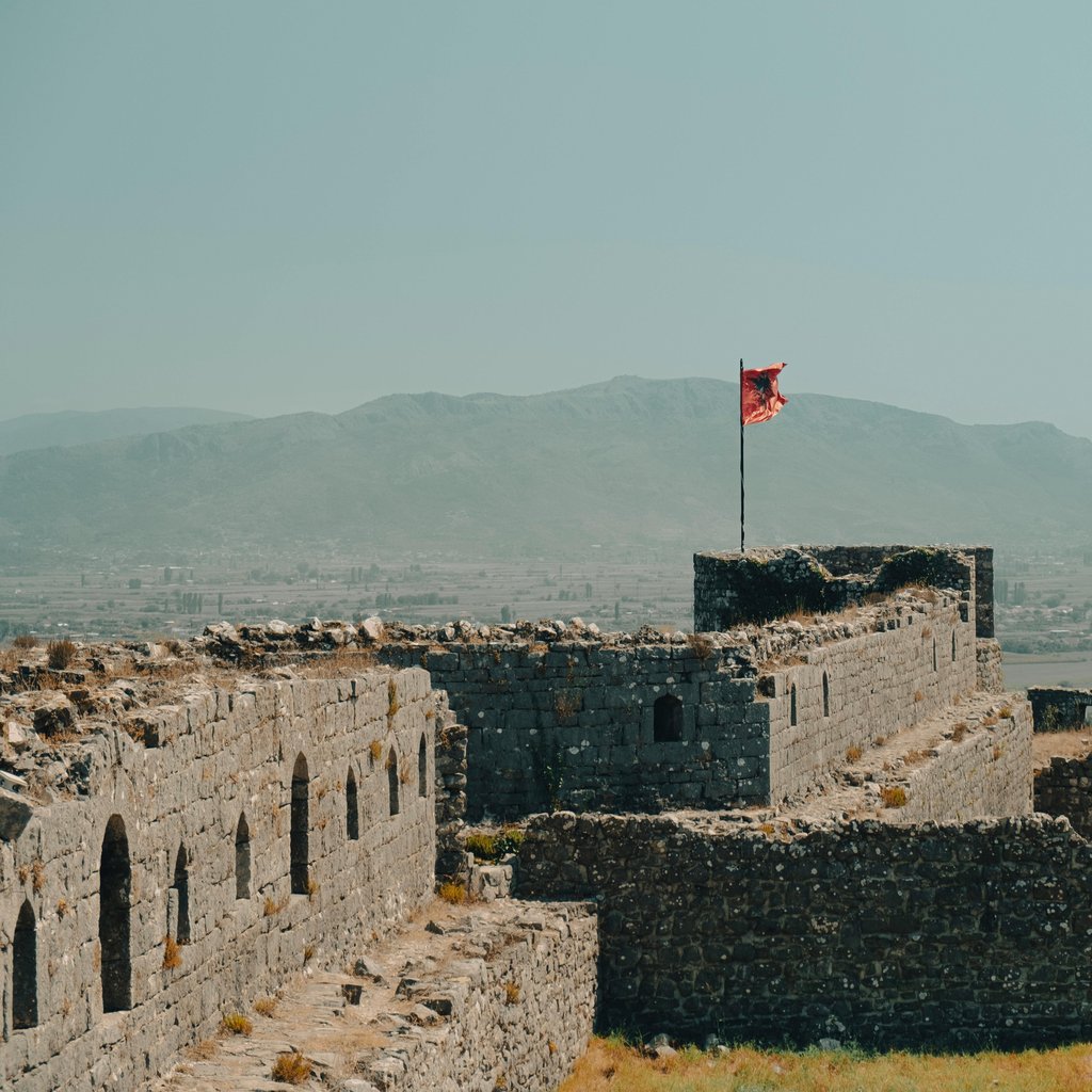Explore the ancient ruins of Rozafa Castle in Shkodër, Albania with a view of the surrounding landscape.