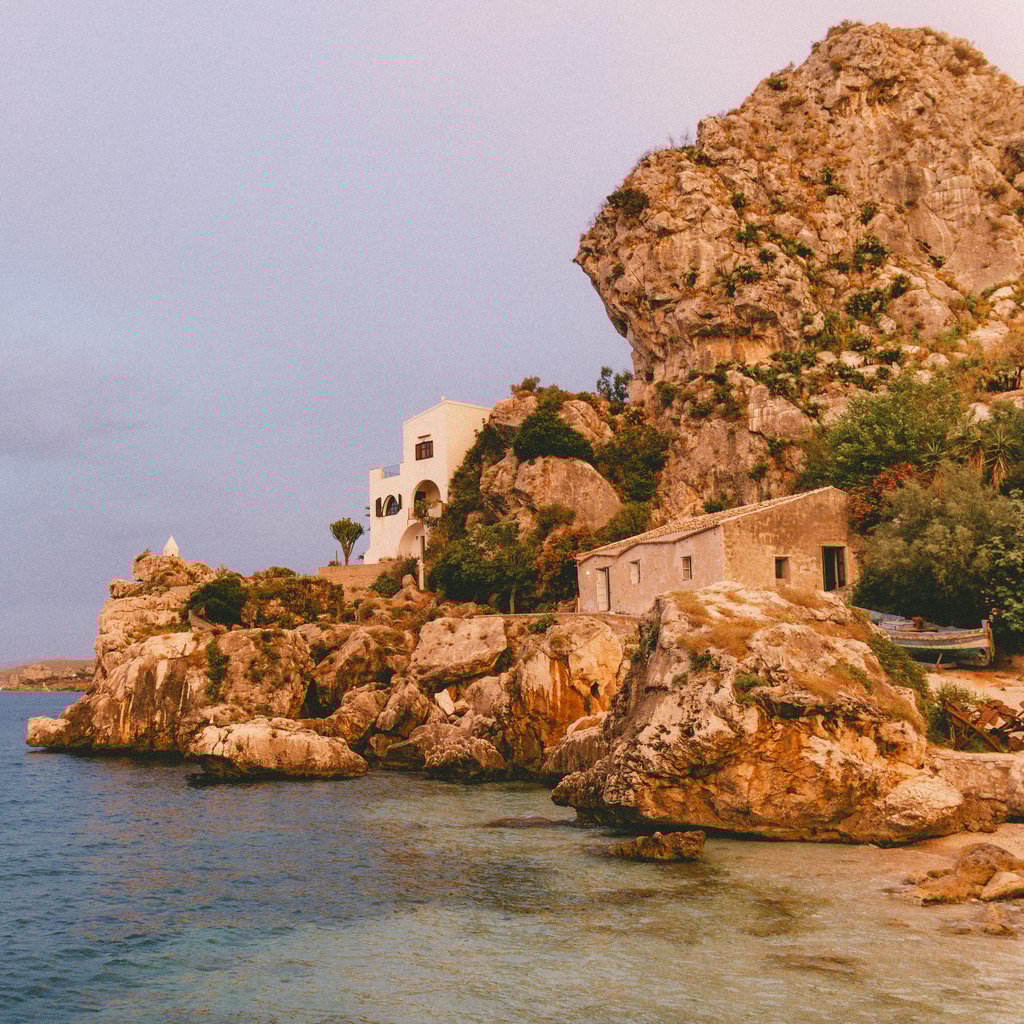 Beautiful rocky coastline in Scopello, Sicily, showcasing cliffs and serene sea views.