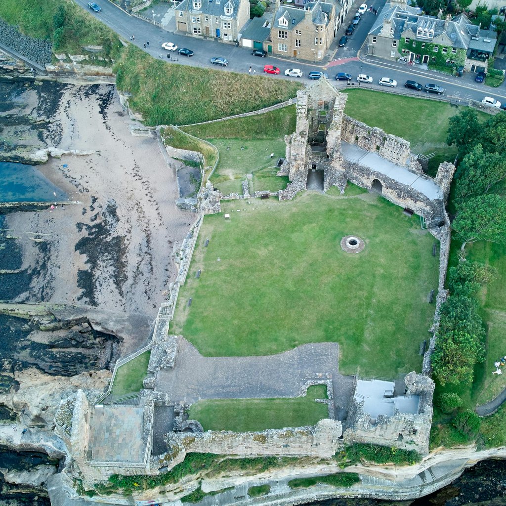 Drone shot showcasing the historical ruins of St Andrews Castle, Fife, Scotland.