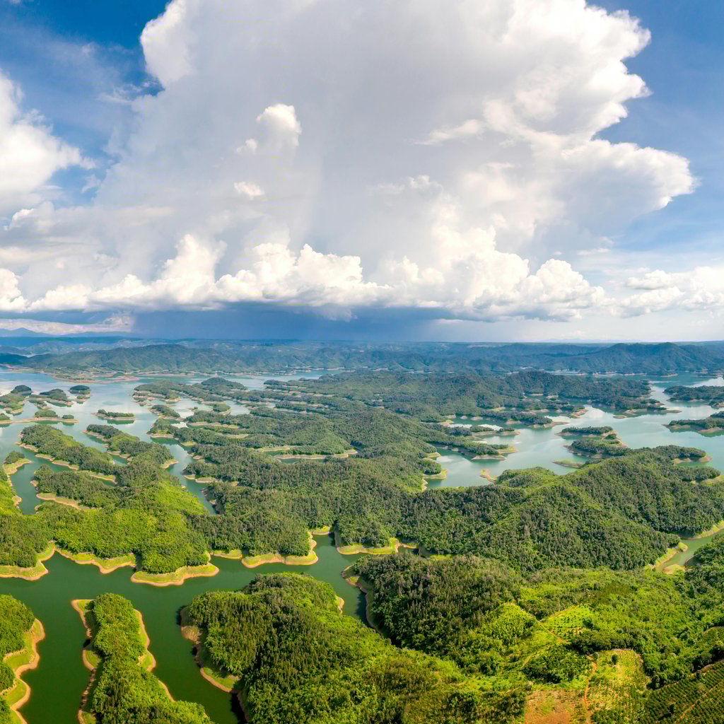 A breathtaking aerial view of Ta Dung National Park, showcasing lush forests and vibrant waterways.