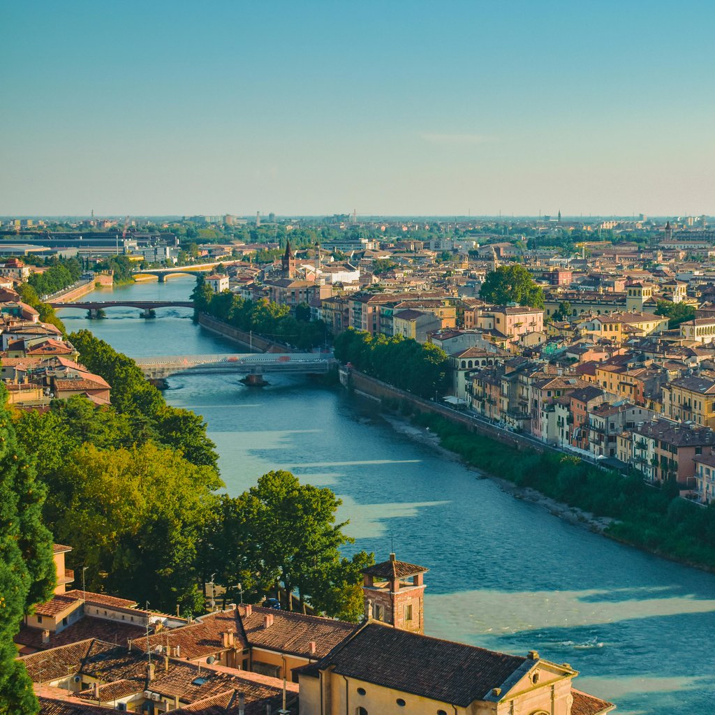 Discover the charming cityscape of Verona, Italy, captured from above with its architectural landmarks and winding river.