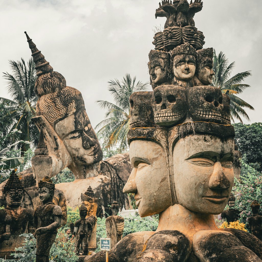 Sculptures at Buddha Park in Vientiane, Laos showcasing intricate carvings, perfect for cultural exploration.
