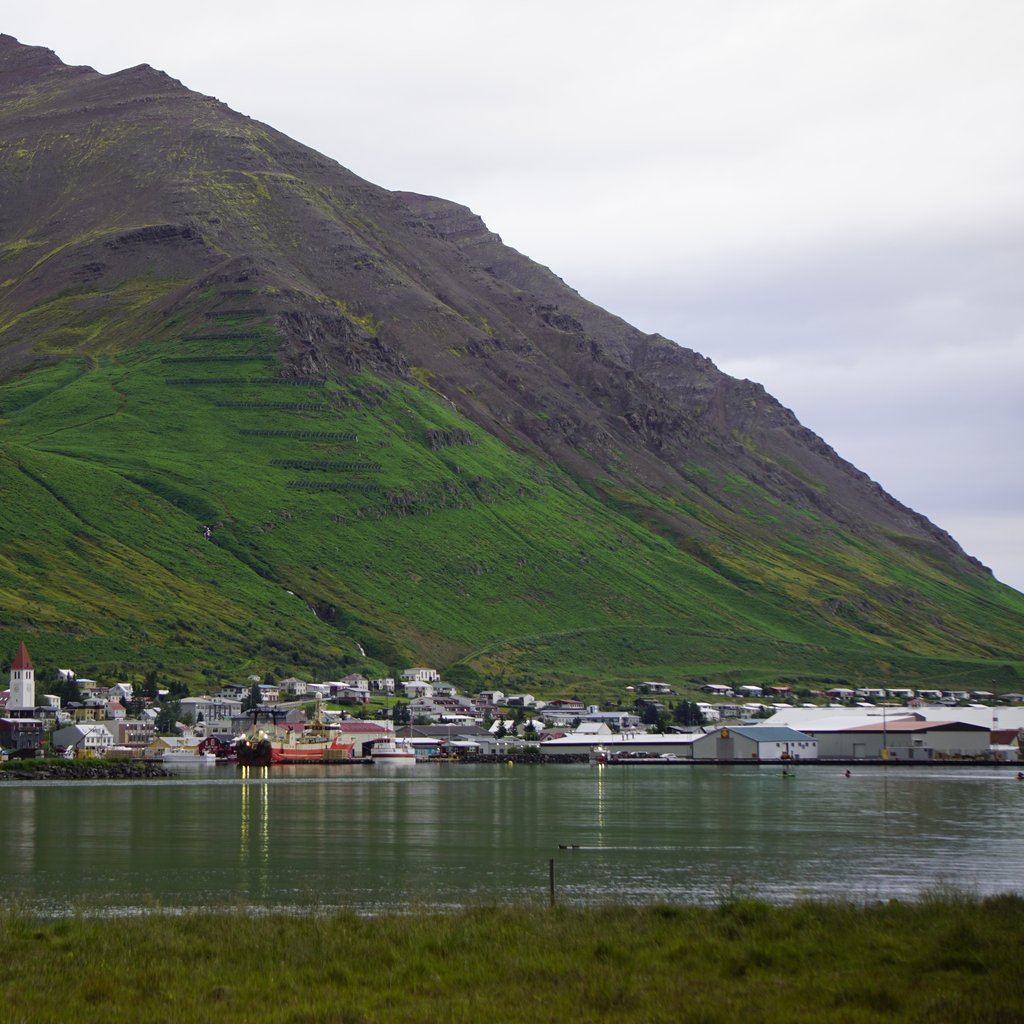 Image of the village of Siglufjörður, as viewed from the end of the village airfield, on the east-bank of the fjord. Image taken in mid-August.